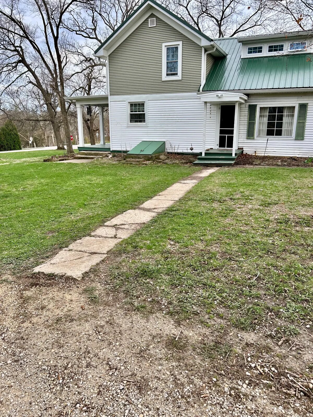 Uneven limestone walkway before replacement